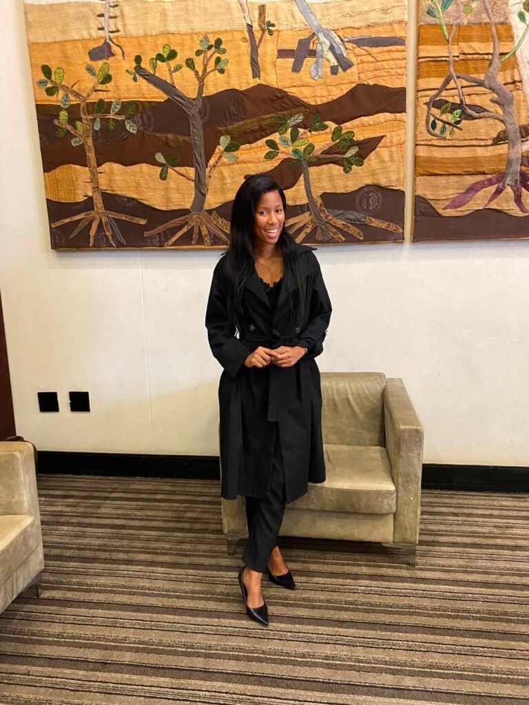 young lady posing & smiling
